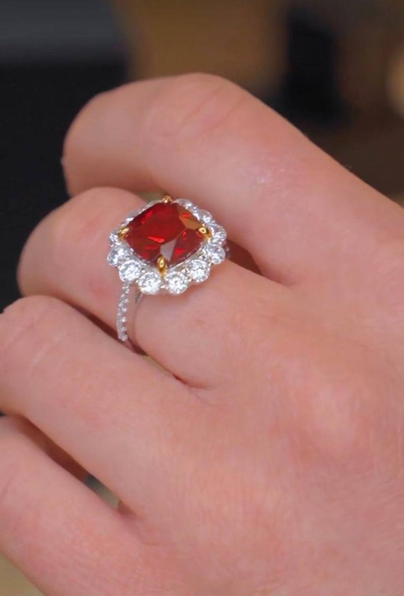 Red-stone halo ring on the hand