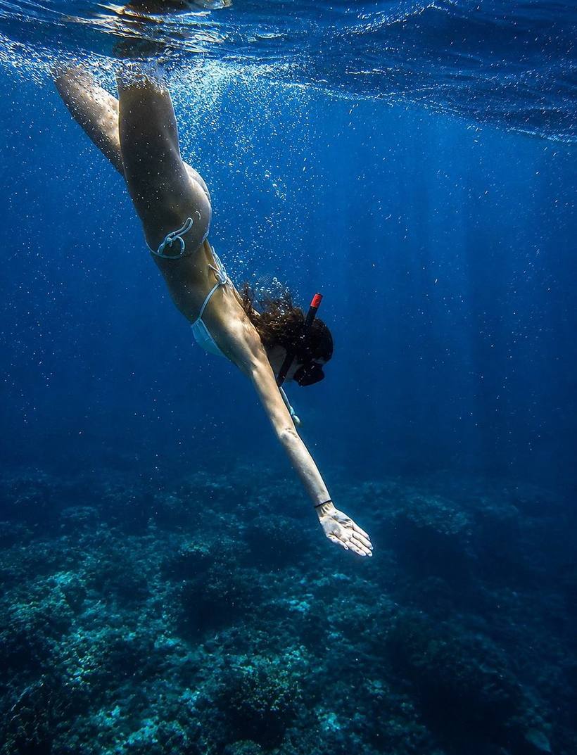 Free-diving toward a reef